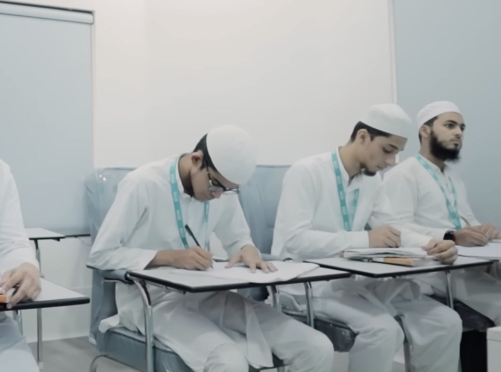 Alimiyat Plus students writing in class
